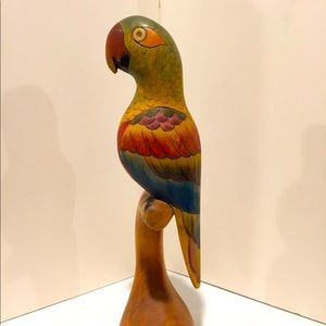 Hand carved and painted wooden parrot on perch